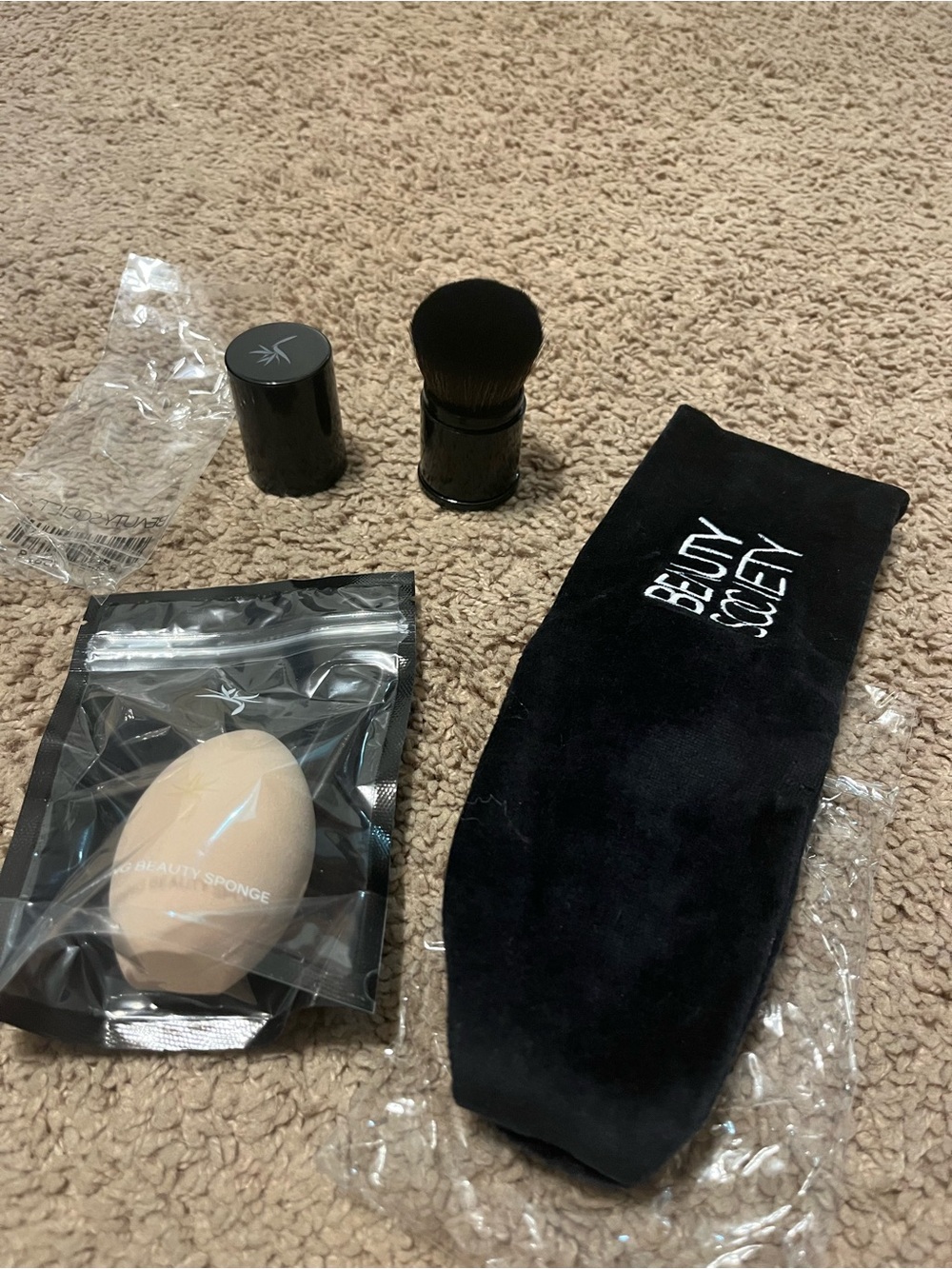 Makeup sponge, headband and retractable brush